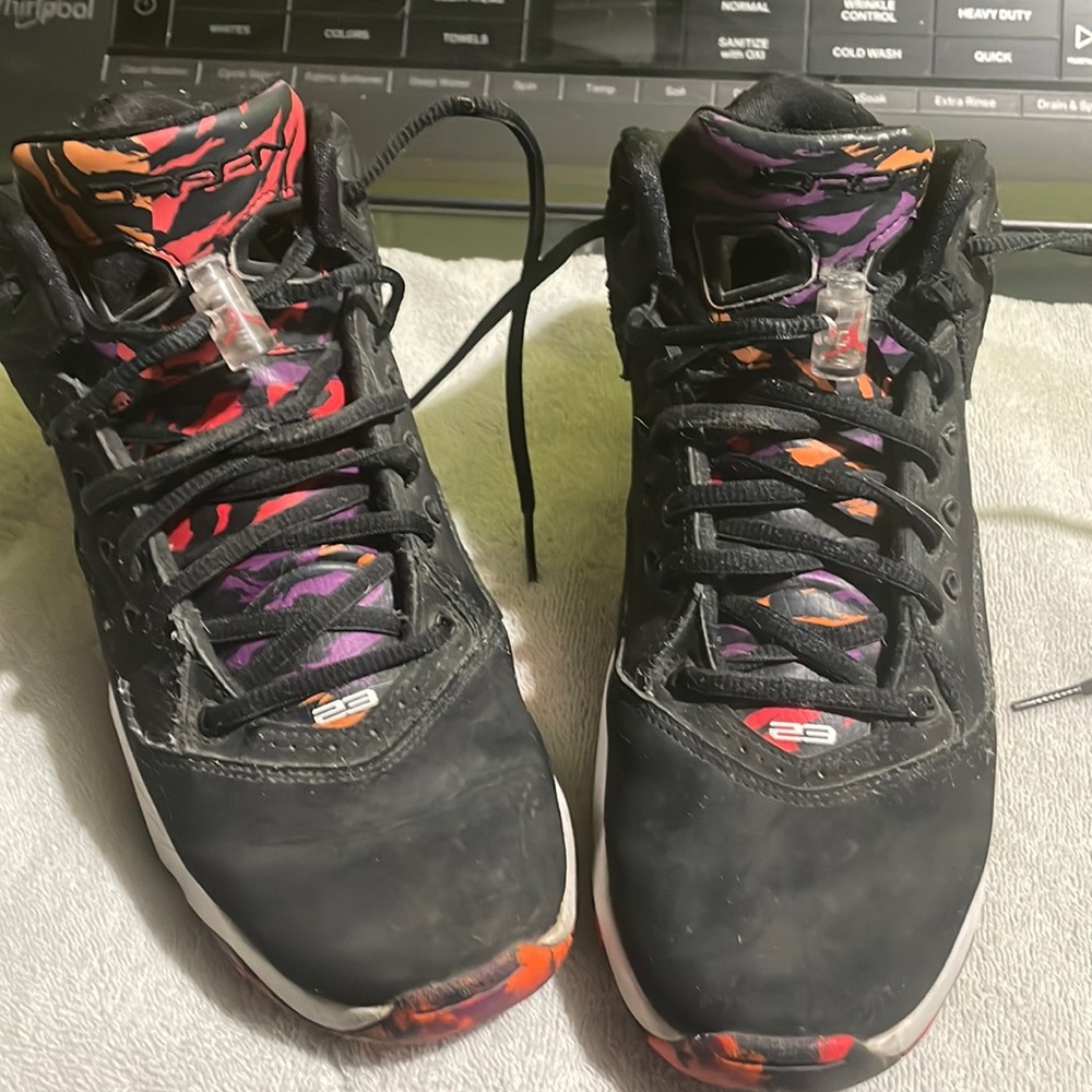 Nice pair of Jordans black/orange they do have some wear and tear.